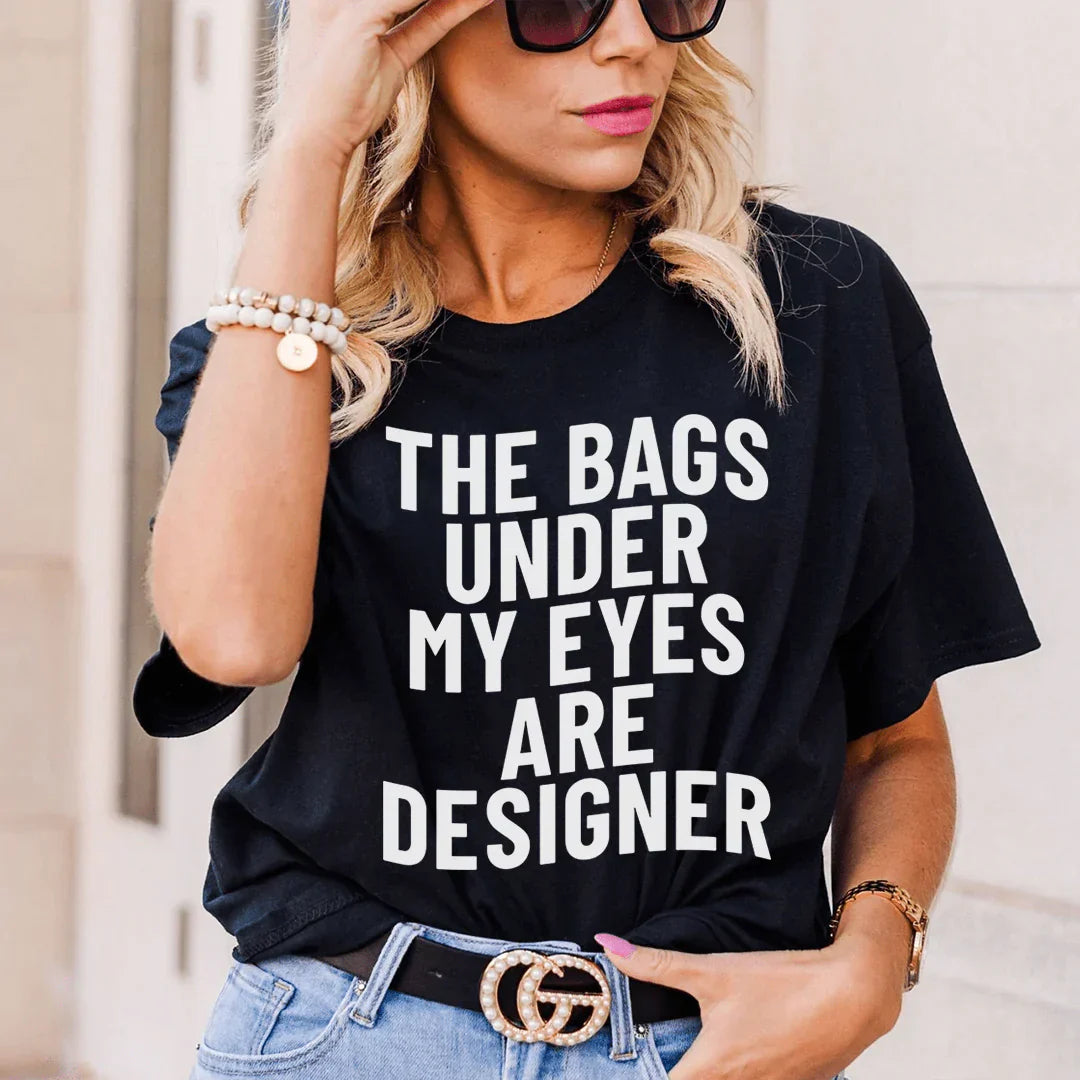 t-shirt « les poches sous mes yeux sont des sacs de créateurs »