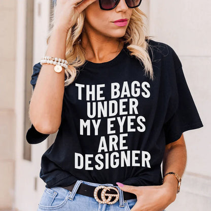 T-shirt « Les poches sous mes yeux sont des sacs de créateurs »